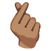 hand with index finger and thumb crossed: medium skin tone on Google