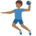 man playing handball: medium-dark skin tone on Twitter/X
